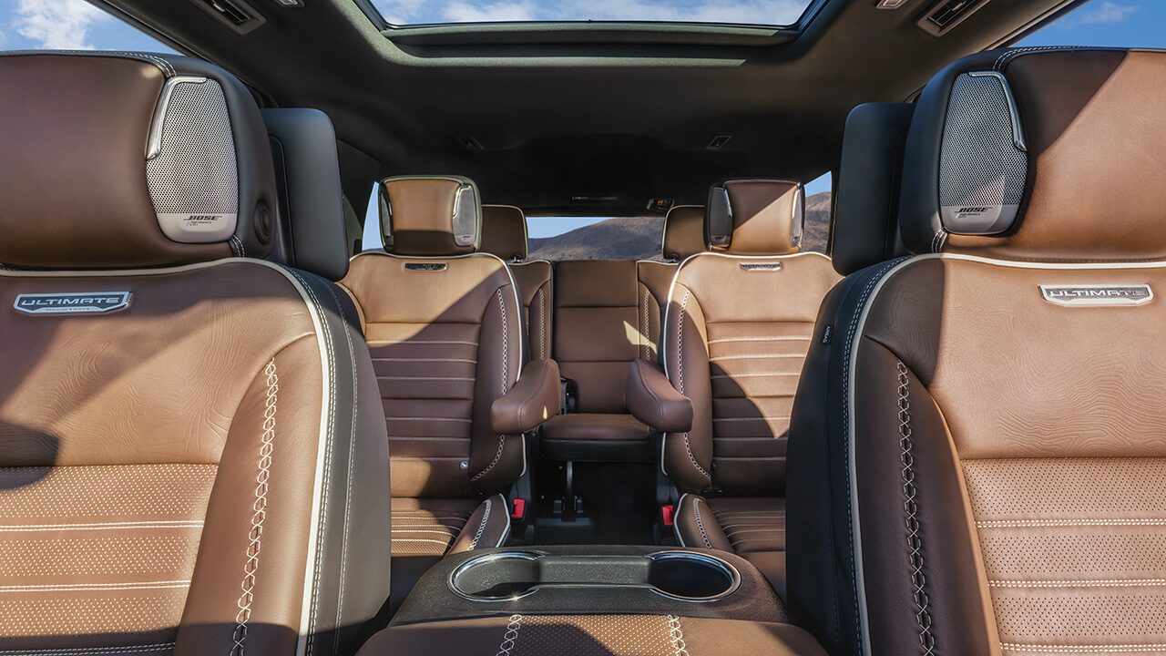 Brown Leather Interior Seats with Ultimate Branding and Bose Speakers in a GMC Vehicle with a Sunroof