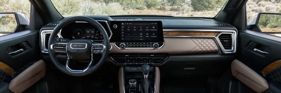 Close-Up View of the Interior Dashboard and Infotainment System in a GMC Denali Vehicle