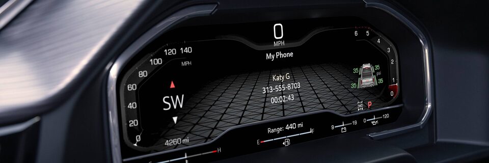 Close-up View of the Digital Cockpit in a GMC Denali Vehicle Showing Hands-Free Calling Application In Use