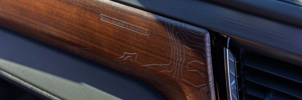 Close-up View of Wood Paneling on the Dashboard in a GMC Denali Vehicle