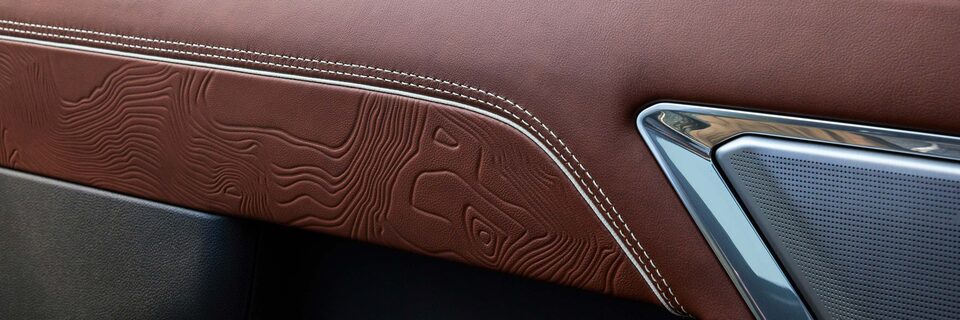Close-up View of Leather and Denali Ultimate Logo on the Door