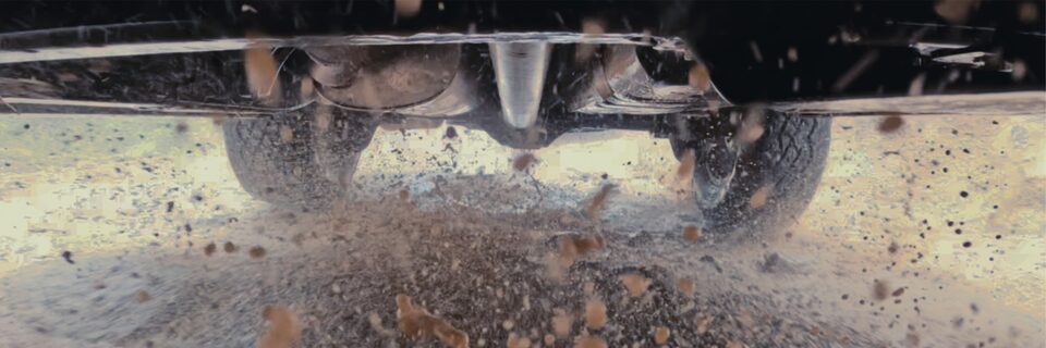 View From the Underbody Camera as the GMC Canyon AT4X Speeds Down a Dirt Road