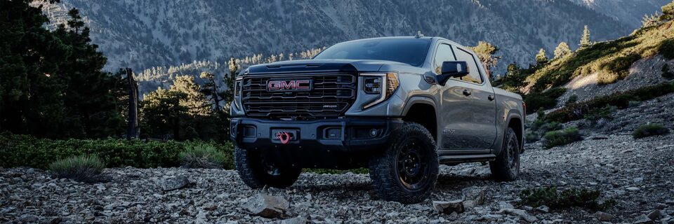 Three-Quarters View of the GMC Sierra AT4X with a Mountain View in the Distance