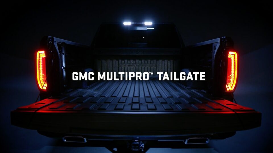 Eye Level View of the Truck Bed of a GMC Pickup Truck with the Taillights on