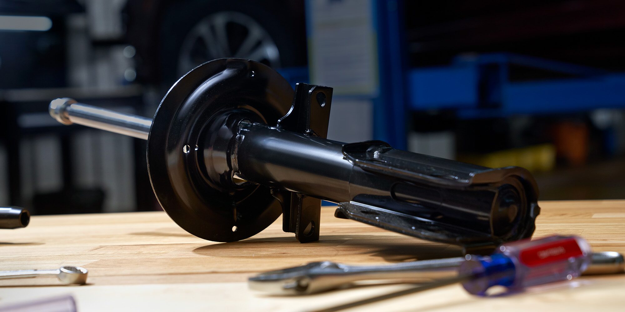 A Mechanic Is Seen Inspecting a Windshield Wiper