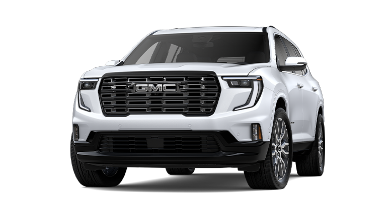 Front Three-Quarters View of a White 2026 GMC Acadia Denali Luxury SUV Driving Down a Long Driveway