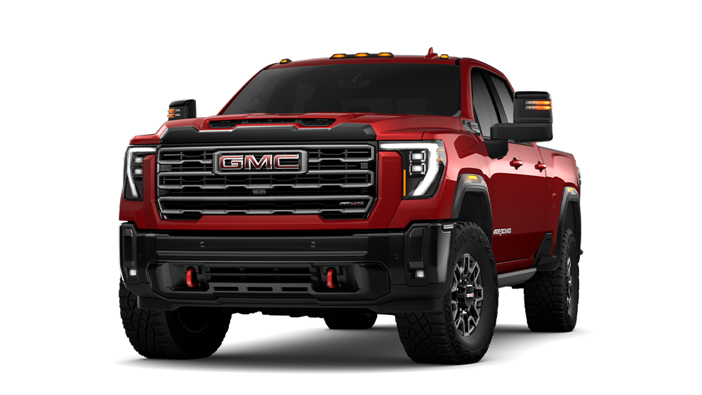 Front Three-Quarters View of the GMC 2026 Sierra HD AT4X Heavy Duty Off-Road Truck in the Color Volcanic Red