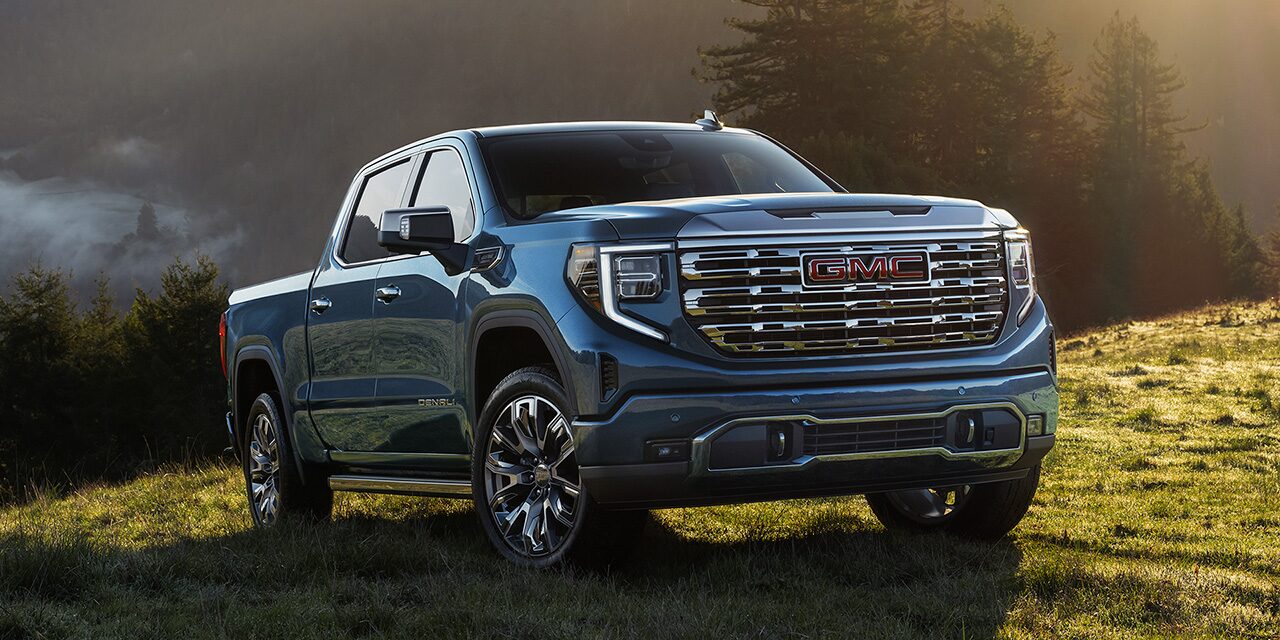 The GMC Sierra 1500 Full-Size Truck Parked in a Green Valley