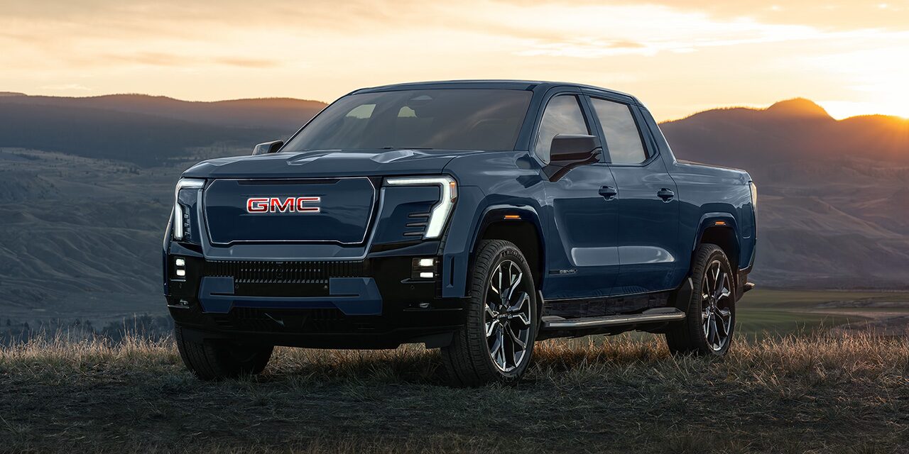 Front Three-Quarter View of the Sierra EV Pickup Truck Parked on the Beach
