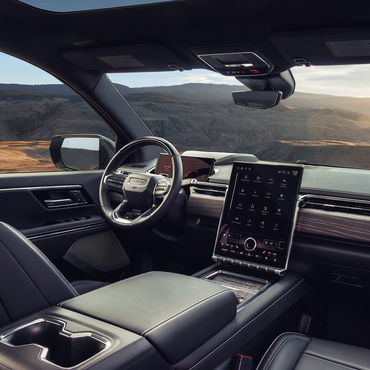 Interior View of the Steering Wheel and Infotainment Screen in the Sierra EV Pickup Truck