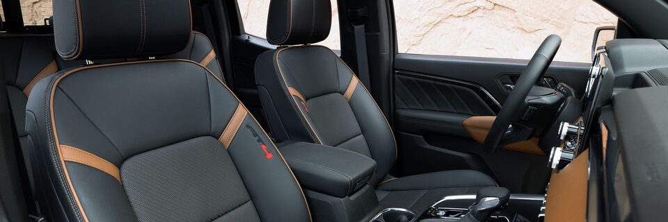 Passenger Door View of the 2025 GMC Canyon Front Row Interior and Leather Seats