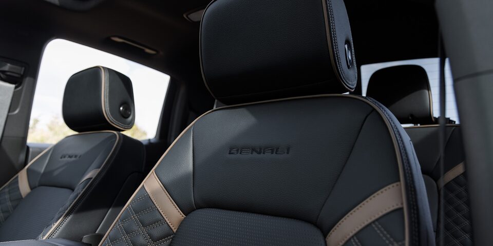 Close-up of the 2025 GMC Canyon Denali Front Row Leather Seats with Trim Printed on Seat