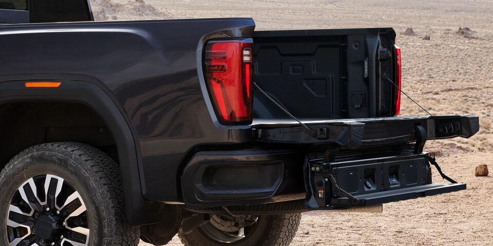 Close-up View of the MultiPro Tailgate with Step Lowered on a 2025 GMC Sierra HD Truck