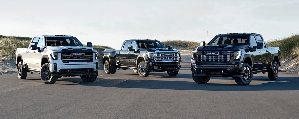 Lineup of 2025 GMC Sierra HD Trucks Parked Near Each Other