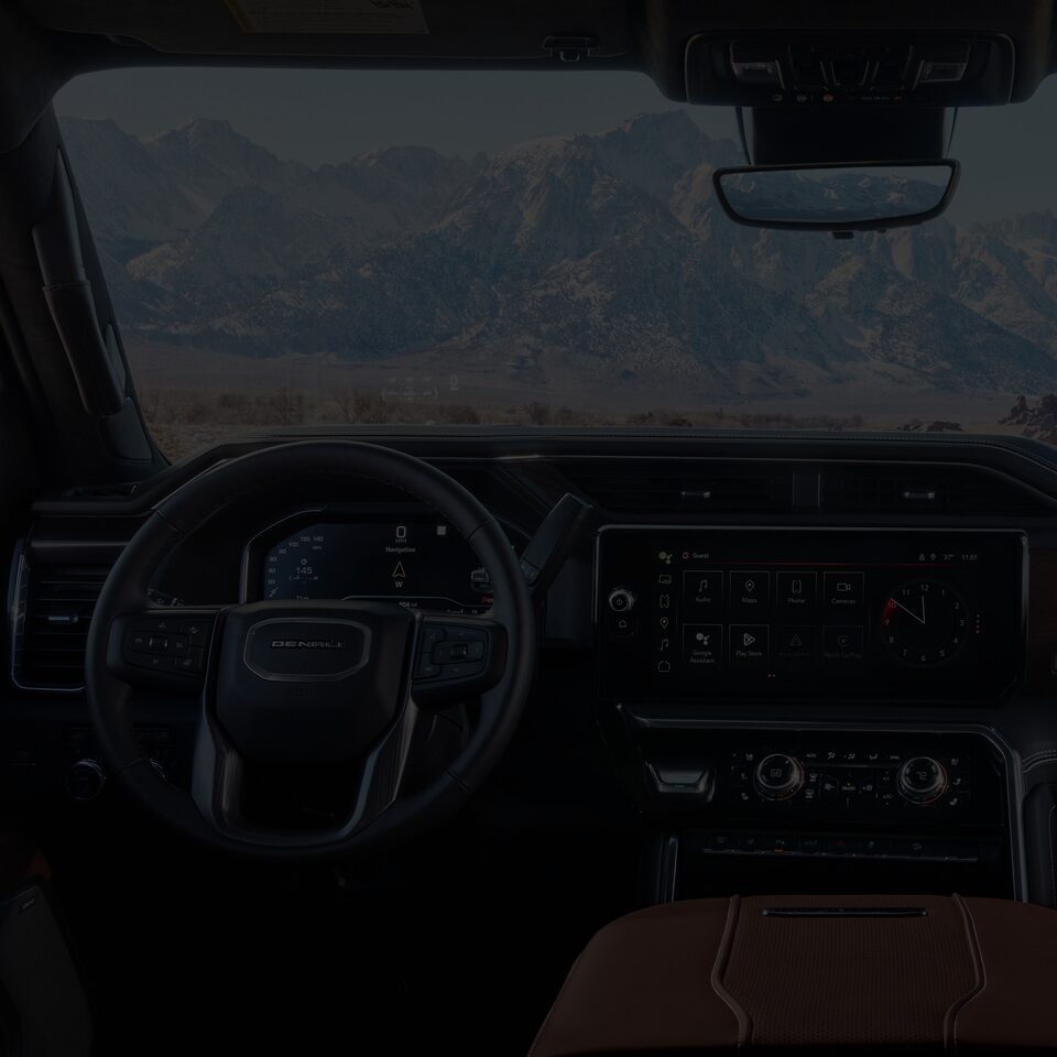 Interior View of the Steering Wheel, Infotainment System and Dashboard in a 2025 GMC Sierra HD