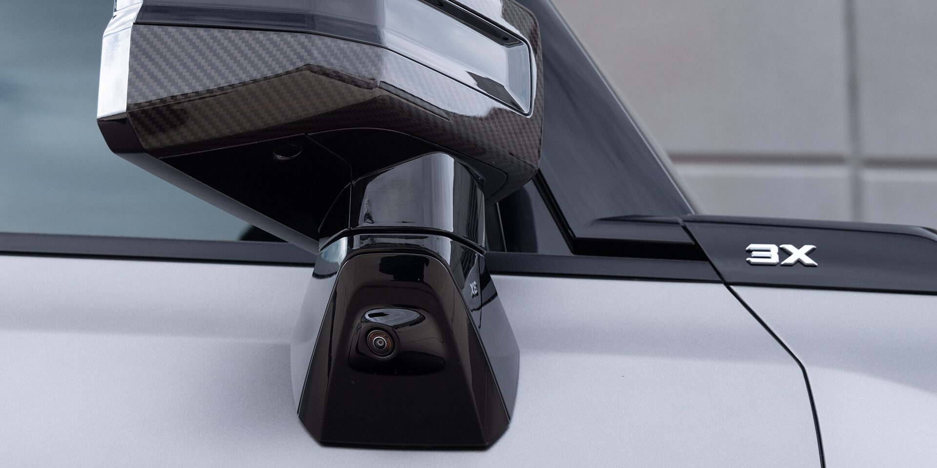 Close-up View of One of the 2026 GMC HUMMER EV's Ultra Vision Cameras on the Exterior Side Mirror