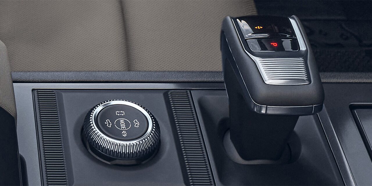 Close-up of the 2026 GMC HUMMER EV Selectable Driver Modes Dial and Shifter