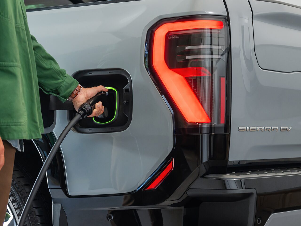 Close-up of the Driver Charging Their 2026 GMC Sierra EV Denali