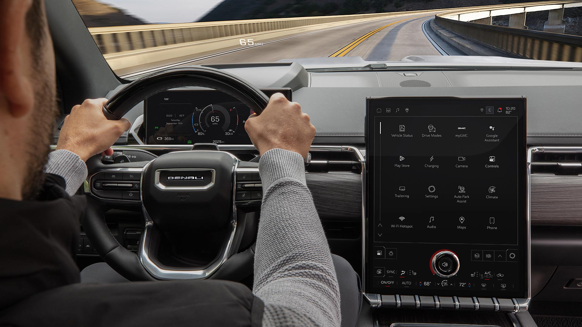 Drivers Side View of the Steering Wheel and Infotainment System in the 2026 GMC Sierra EV Denali