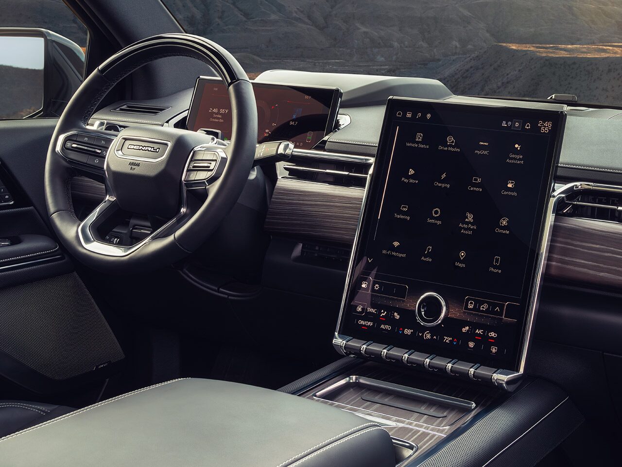 Interior View From the Passengers Seat of the Dashboard, Steering Wheel, and Infotainment System in the 2026 GMC Sierra EV Denali