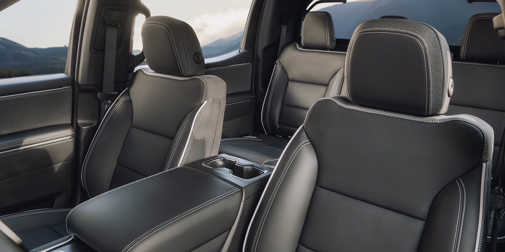 Close-up of the 2026 GMC Sierra EV Interior and Premium Seating of the Front and Back Row