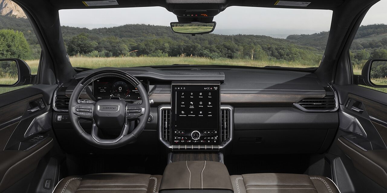 Interior View of the Steering Wheel, Infotainment System and Dashboard in the GMC 2026 Acadia Denali Luxury SUV