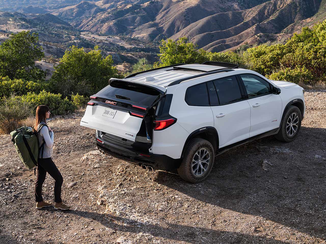 Birds-eye View of a Man Using the Autosense Power Liftgate on the GMC Acadia Mid-Size SUV