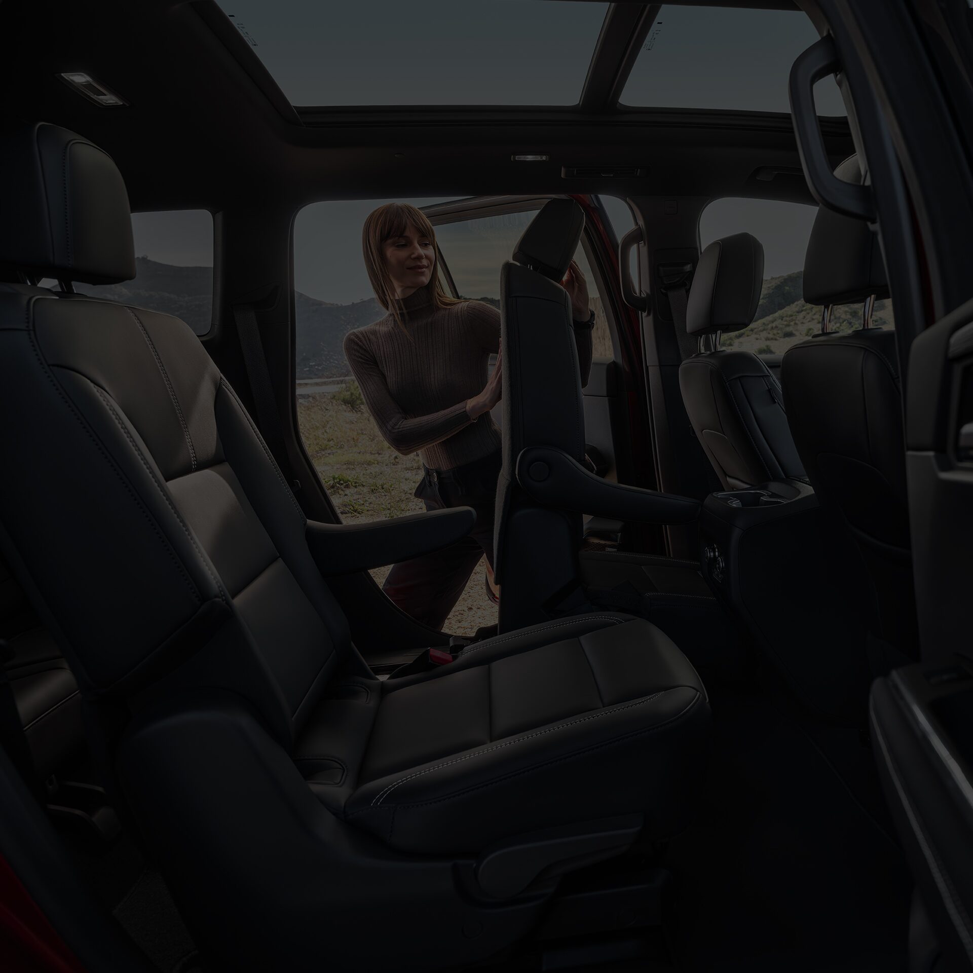 Interior View of the Rear Seats in the 2026 GMC Acadia Mid-Size SUV from the Passenger Side Rear Door
