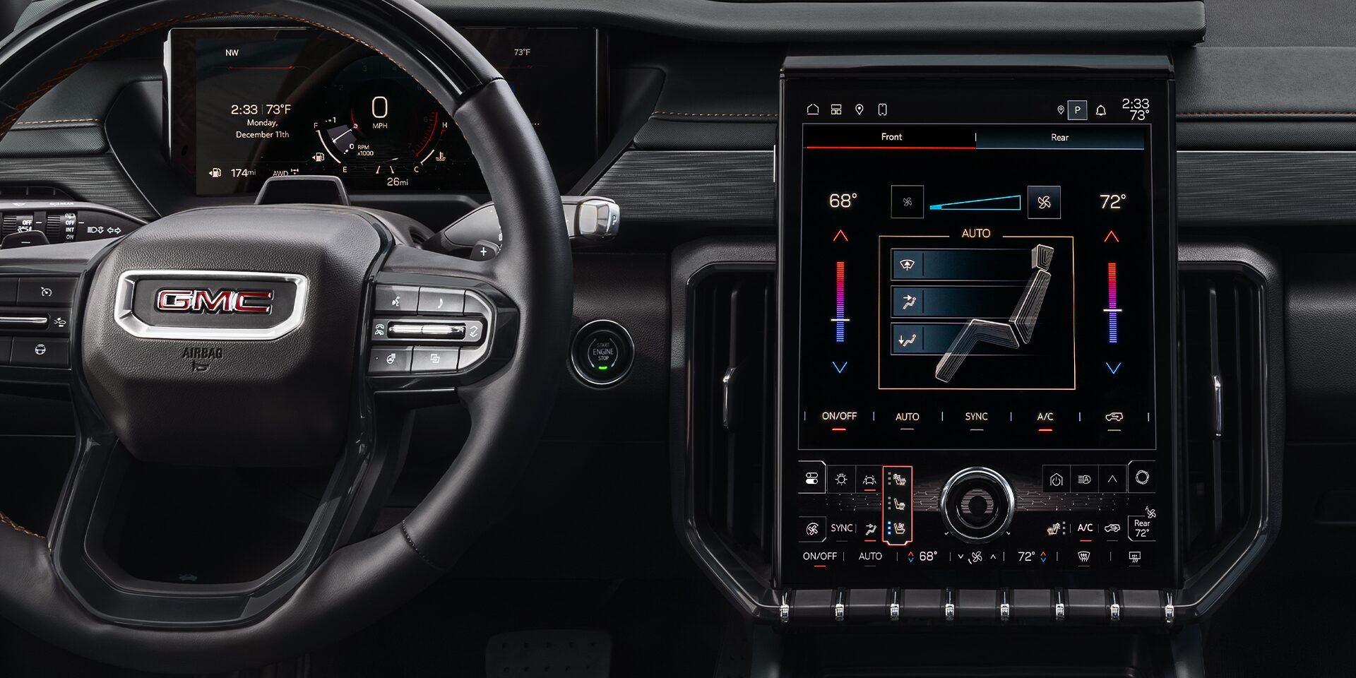 Close-up of the Interior View of the Steering Wheel and Infotainment System in the 2026 GMC Acadia MId-Size SUV