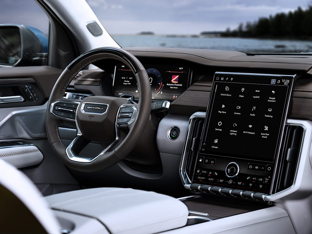 Interior View of the Steering Wheel and Infotainment System in the 2026 GMC Acadia