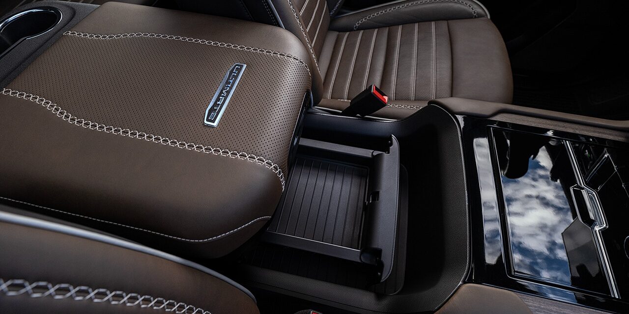 Close-up of the Power-Sliding Center Console in the 2026 GMC Yukon Elevation Full-Size SUV