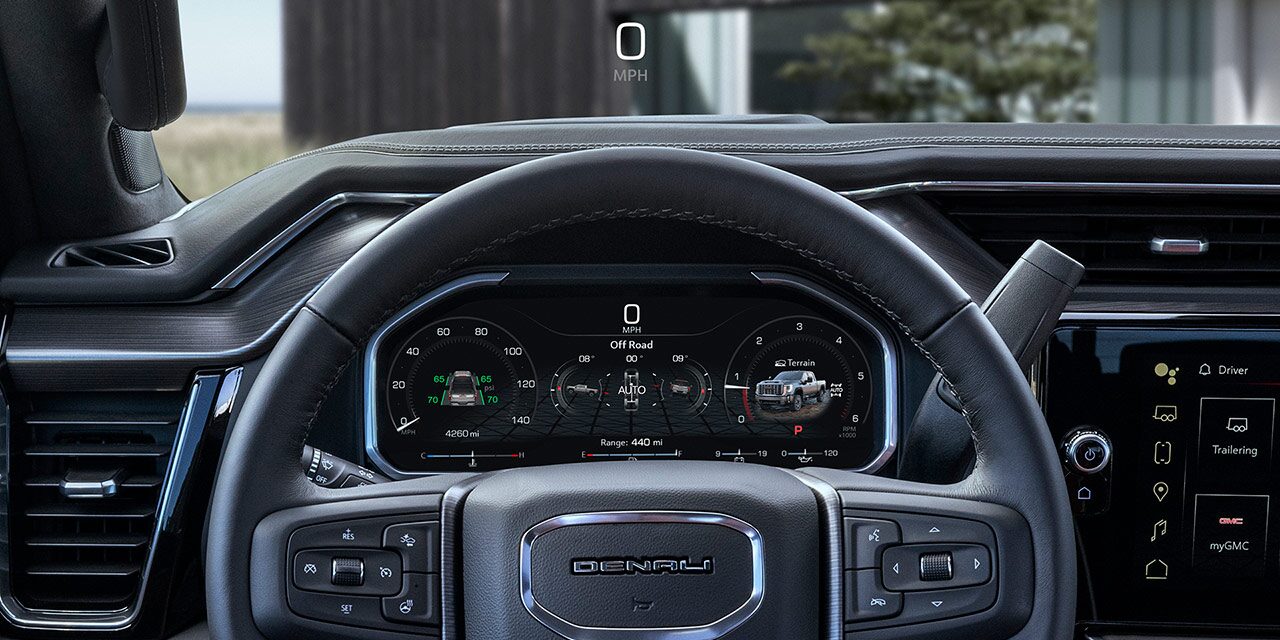 Driver's Seat View of the 2026 GMC Sierra HD Denali Steering Wheel and Driver Information Center