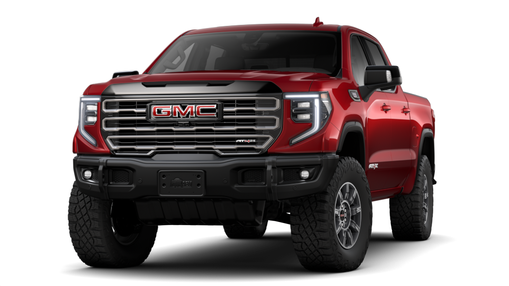 Front Three-Quarters View of a Volcanic Red Tintcoat 2026 GMC Sierra AT4X AEV Off-Road Truck