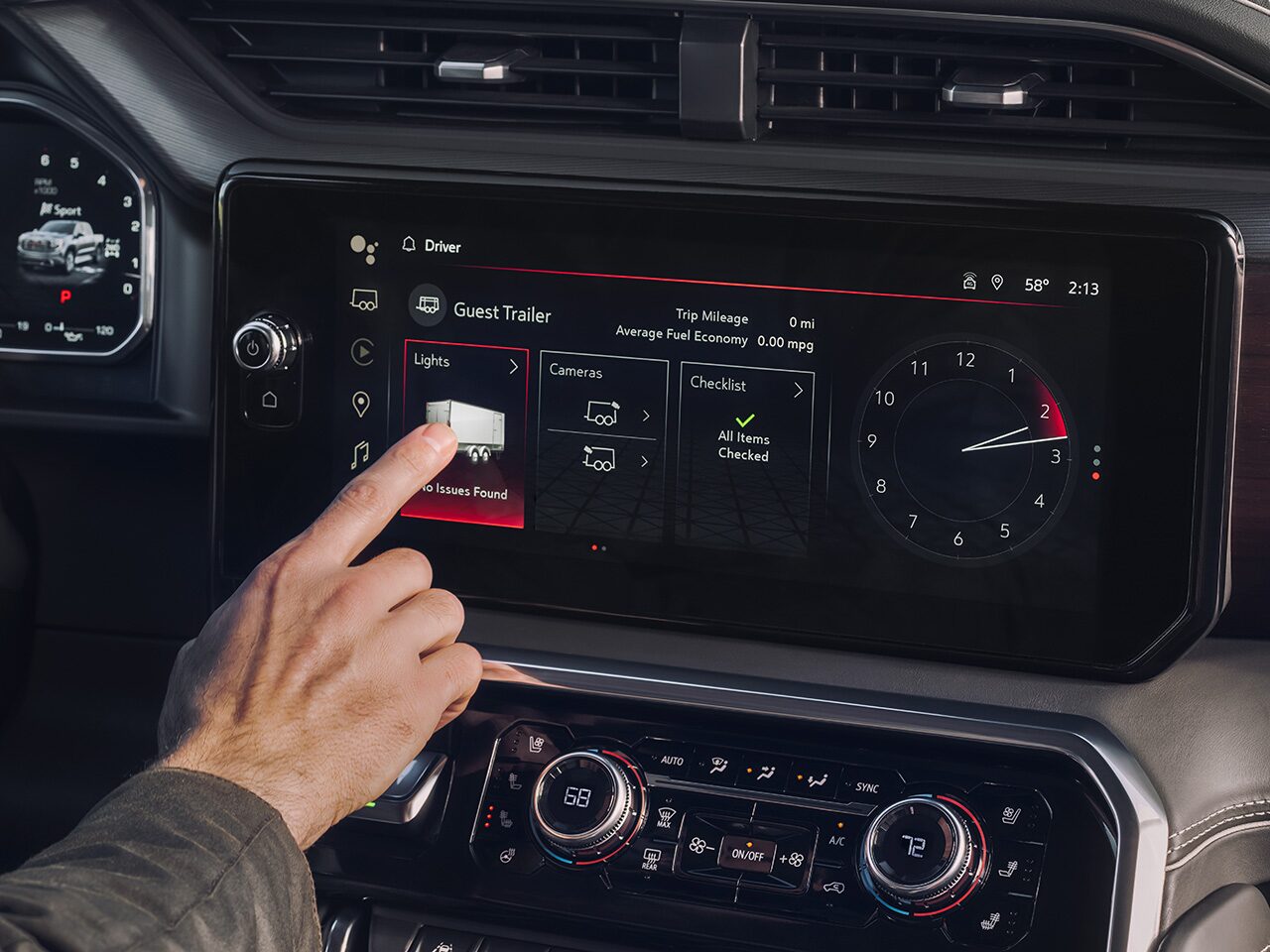 The Driver Pressing an App on the GMC Infotainment System